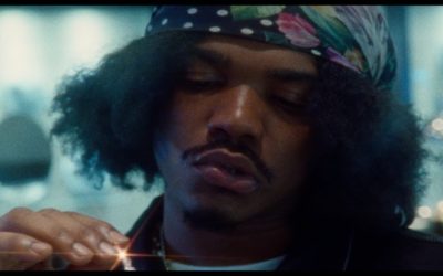 Smino and J. Cole team up for the twisted new video for “90 Proof”